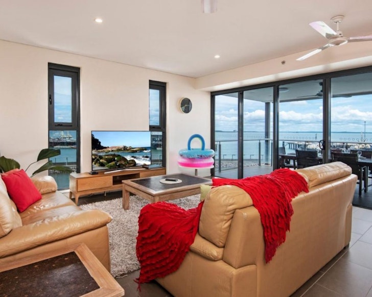 A view of the living space with a water view at Darwin Waterfront Luxury Suites one of the best Darwin hotels