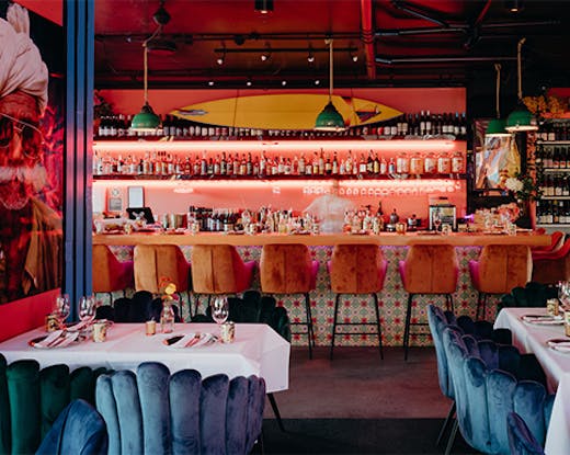 the interior of a vibrant indian restaurant in byron 