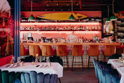 the interior of a vibrant indian restaurant in byron