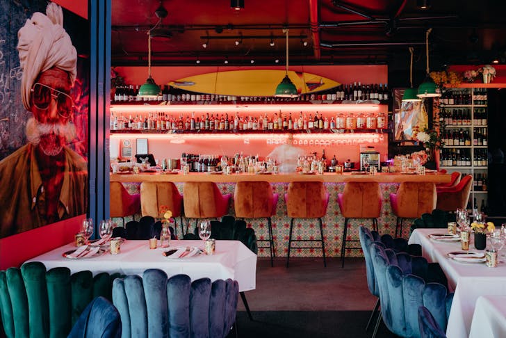 the interior of a vibrant indian restaurant