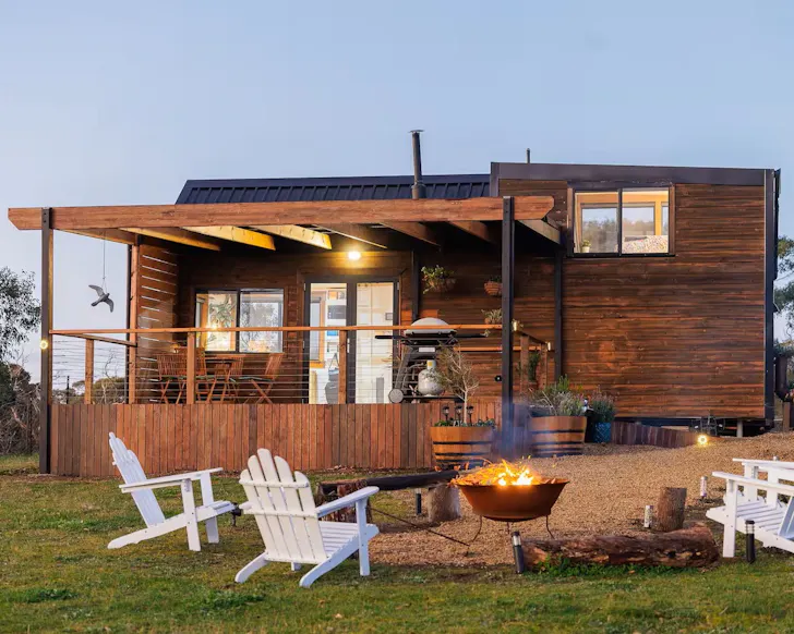 A fire pit sits in front of the house at Deep Creek one of the best Tiny homes in South Australia