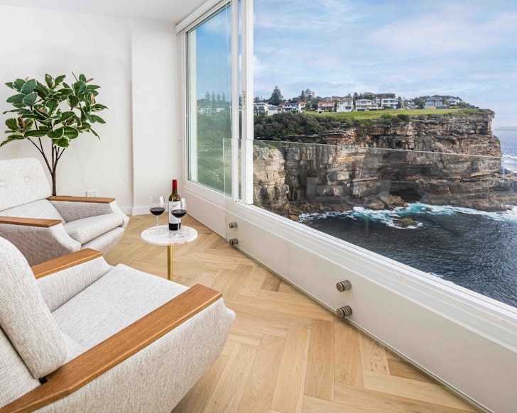 A view of the cliffs from the living space at Diamond Bay Cliff Apartment one of the best Sydney Airbnbs