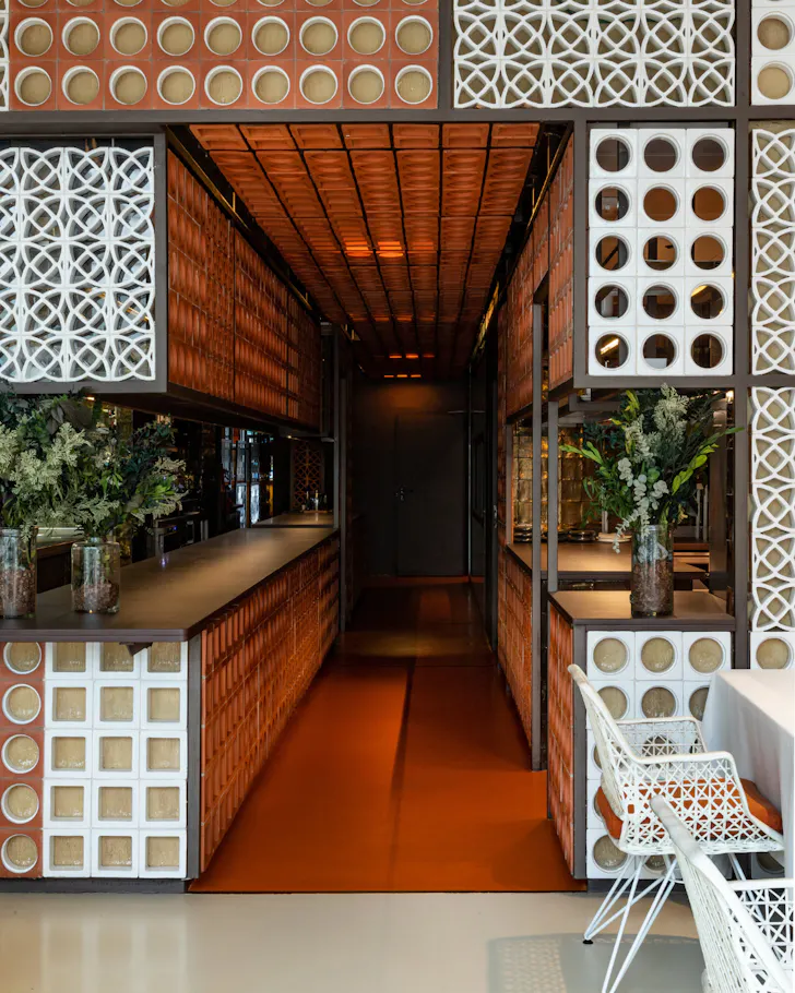 Colourful besser blocks create a striking hallway in Michelin-starred Barcelona restaurant Disfrutar.