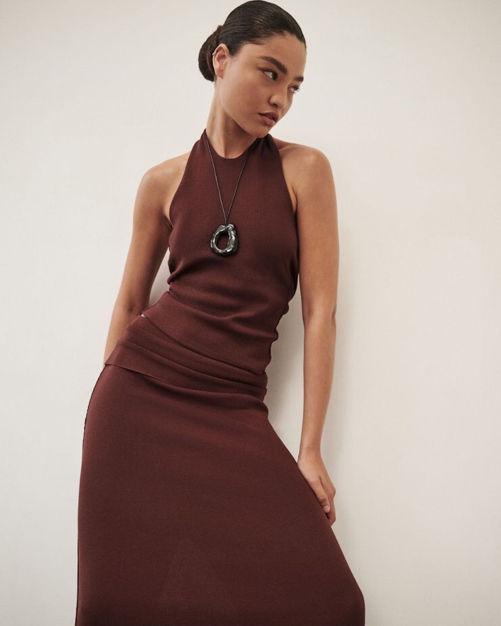 A model wears a burgundy ensemble from DISSH one of the best Australian fashion labels