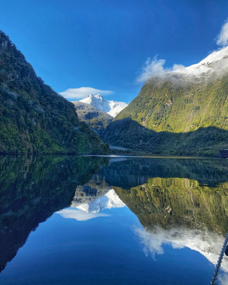 A reflection of the mountains at Doubtful Sound