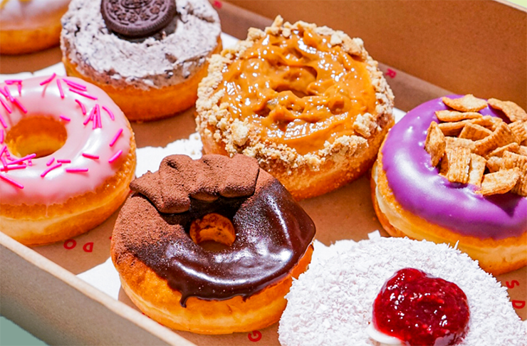 A variety of different donuts with icing, toppings and sprinkles. Some of the best donuts Melbourne.