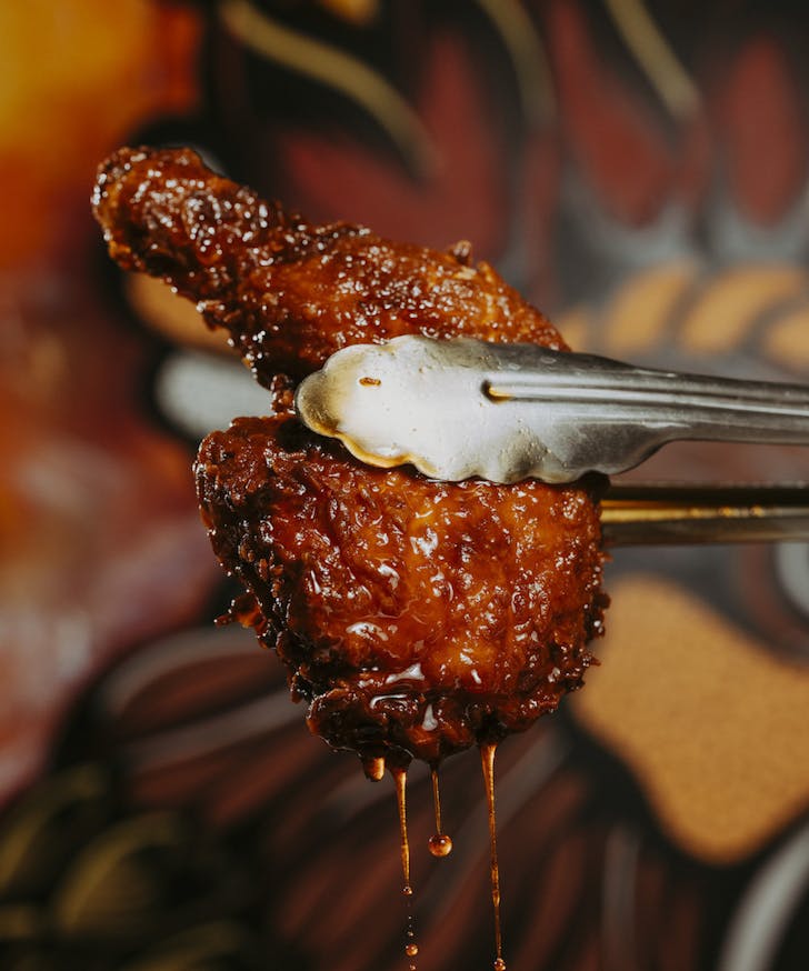 Drasko's Hot Chicken dripping in sauce