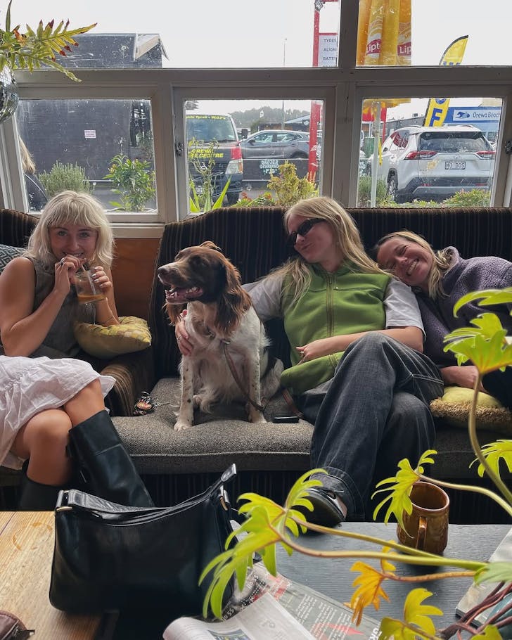 The Drifter team cosy up with a four-legged friend. 