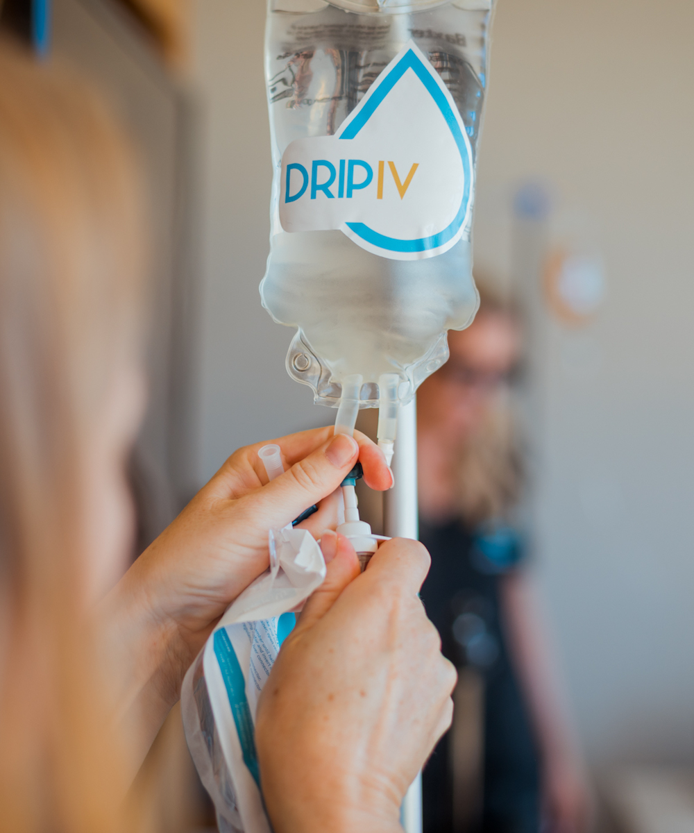 a Drip IV nurse administers the solution