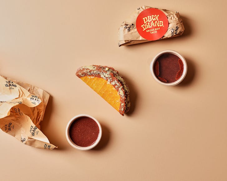 Twof Broke Boy x Duck Island chili chocolate tacos with choc dipping sauce and paper wrappers. 