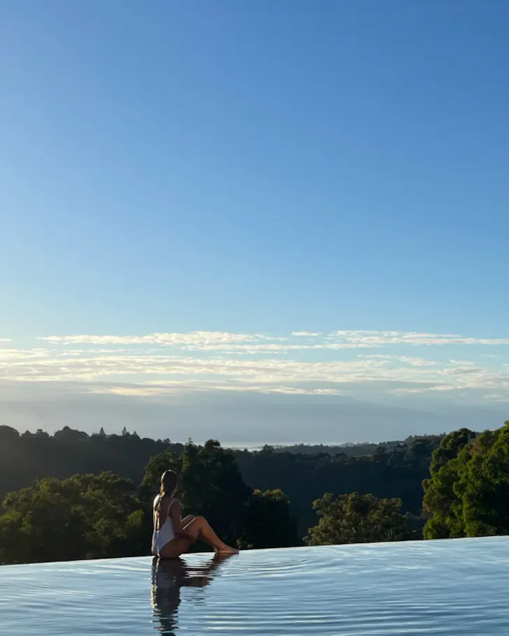 Person on edge of infinity pool