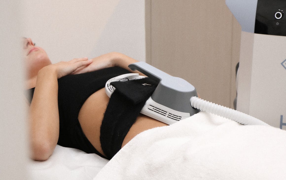 A person having the EMSCULPT treatment on their abs
