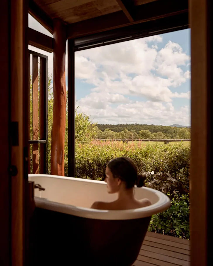 Person in outdoor tub
