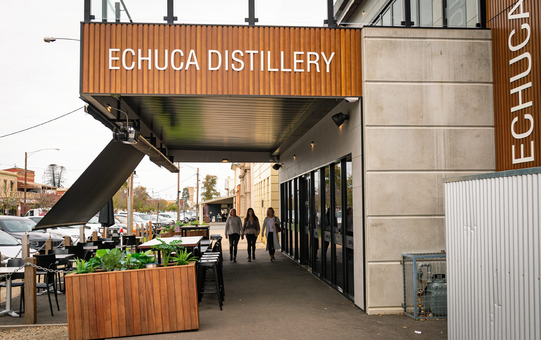 The outside of a shop with people walking into Echuca Distillery in Echuca. 