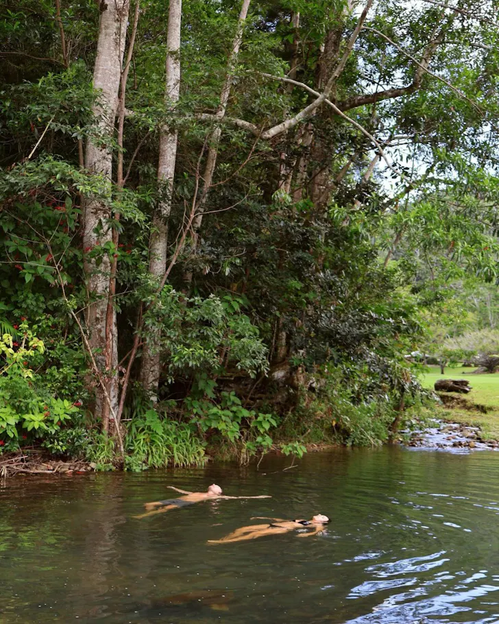 Two guests swim at Eden Retreat one of the best health and wellness retreats Australia