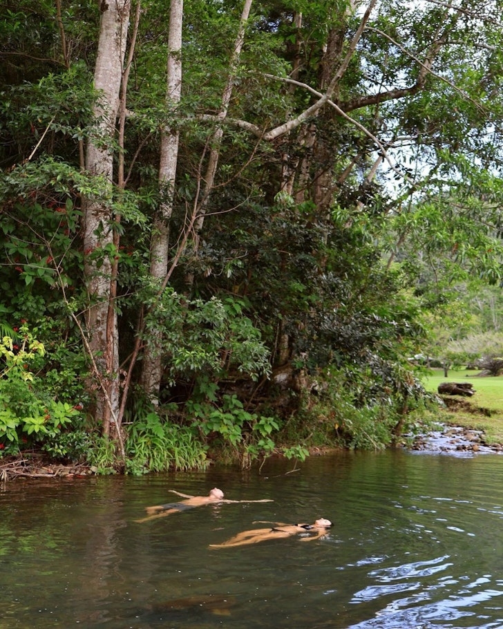Two guests swim at Eden Retreat one of the best health and wellness retreats Australia