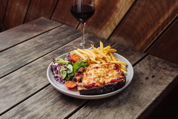 plate of cheesy parma and sides