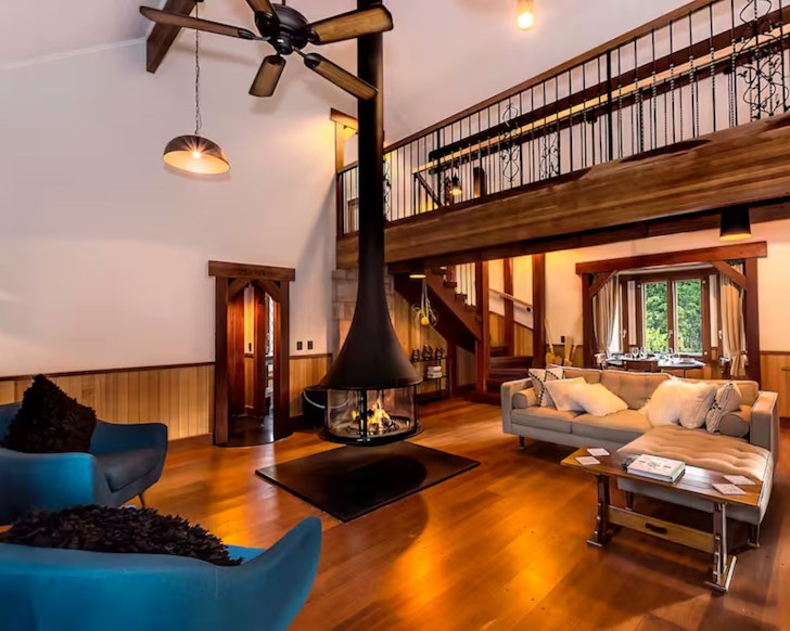 The living space with fireplace at Enchanted Cottage one of the best cottages Gold Coast