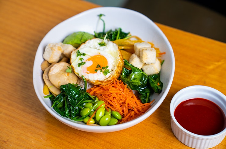 a bowl of fresh vegetables and tofu