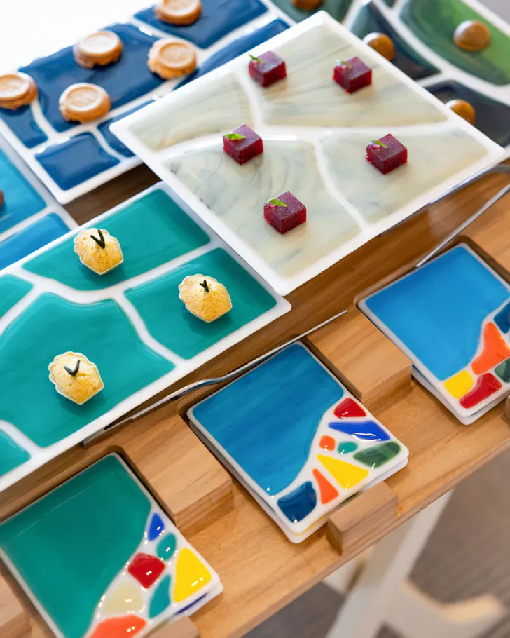 Colourful amuse-bouche set up on Spanish-tile plates at Enoteca Paco Perez.