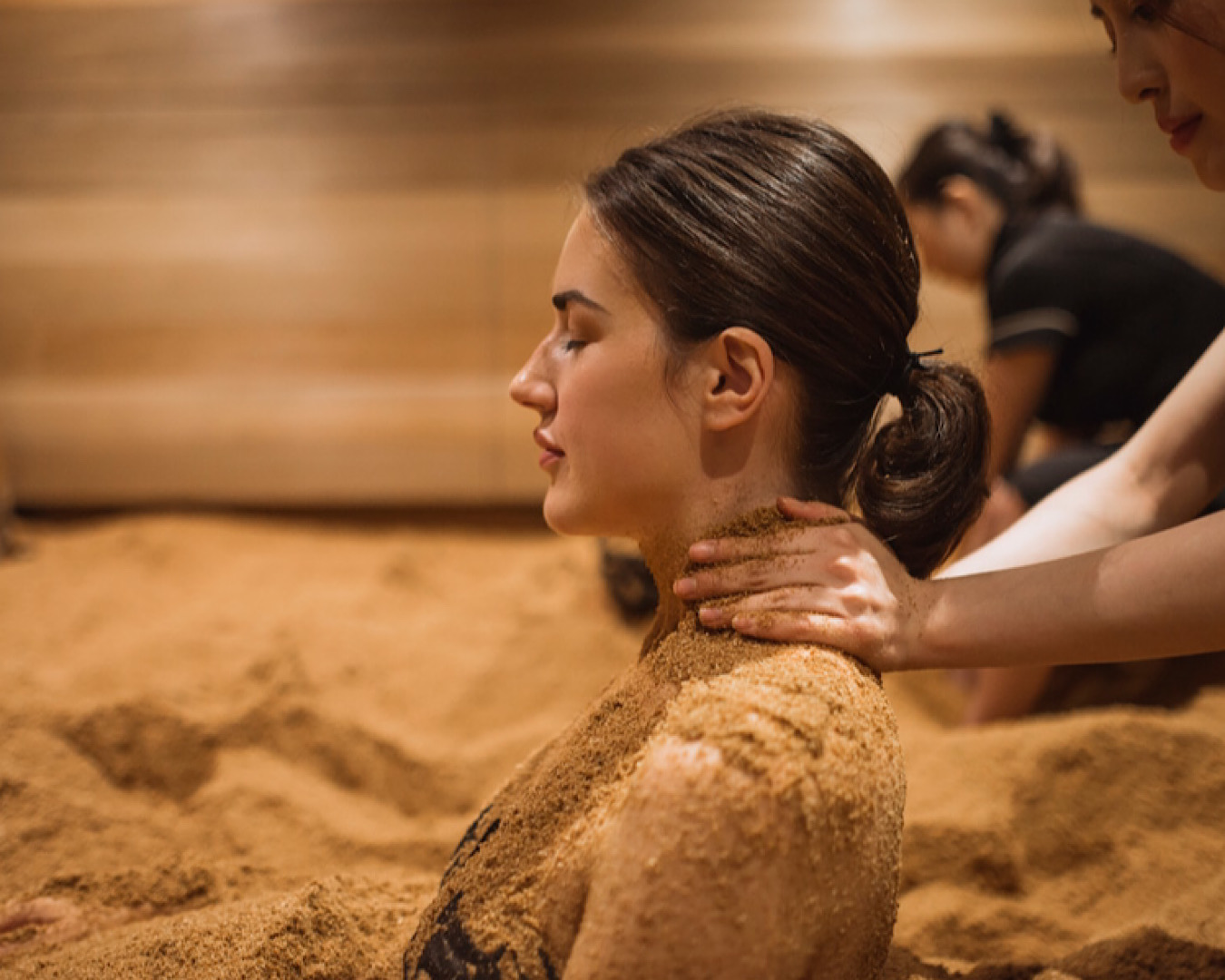 A person receives an enzyme treatment from Ikoi Spa, one of the best spas in Auckland. 