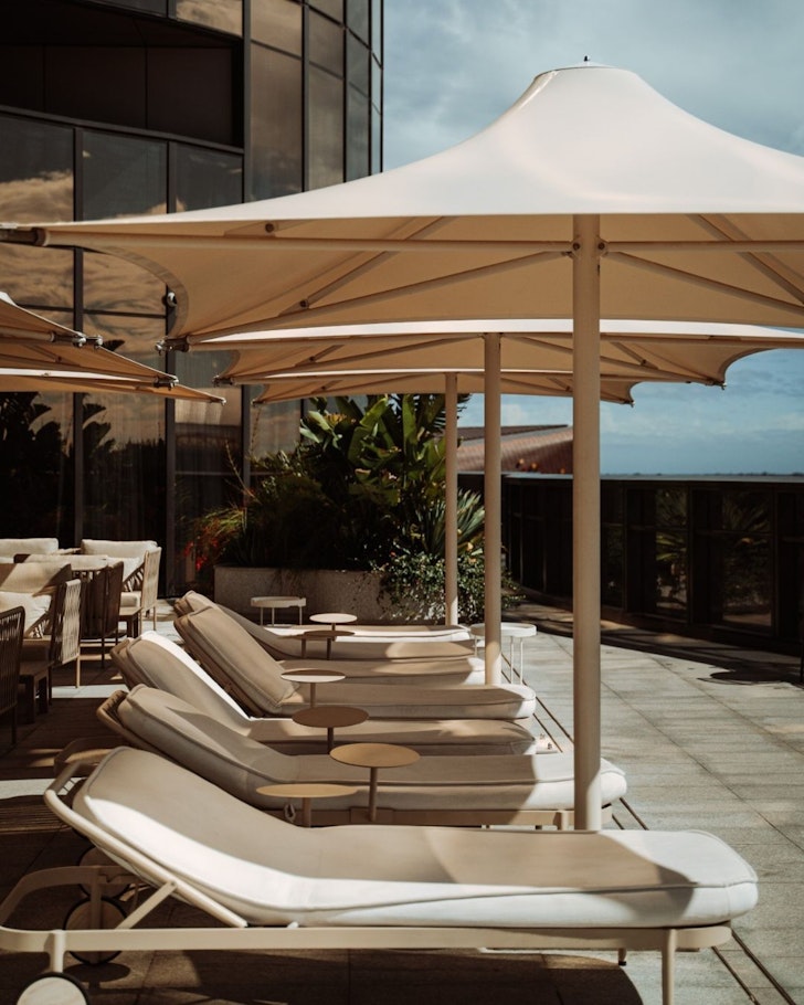 A view of sunloungers on the leisure deck at Eos By Skycity one of the best hotels Australia 