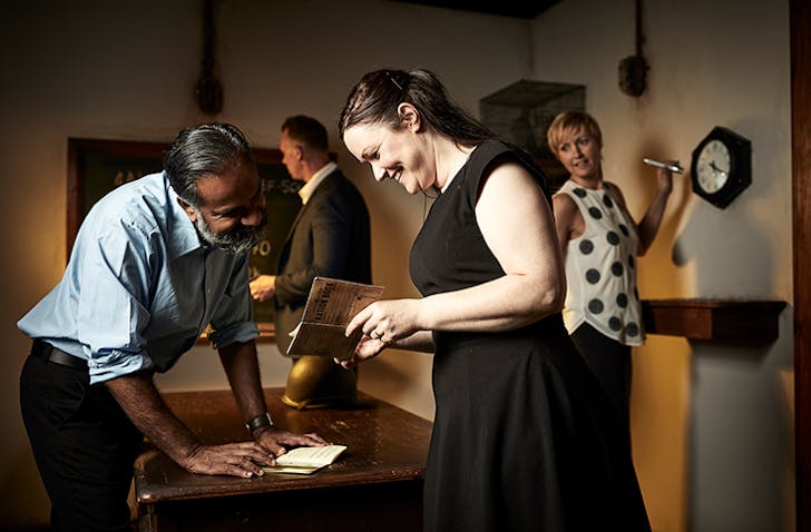 People solving riddles in one of the best escape rooms in Melbourne, Escape Hunt.