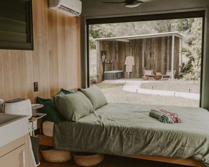 A view to the outdoor bath from the bedroom at Escape to Nelly romantic getaway near Brisbane