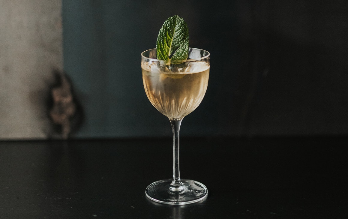 a cocktail in a stemmed glass