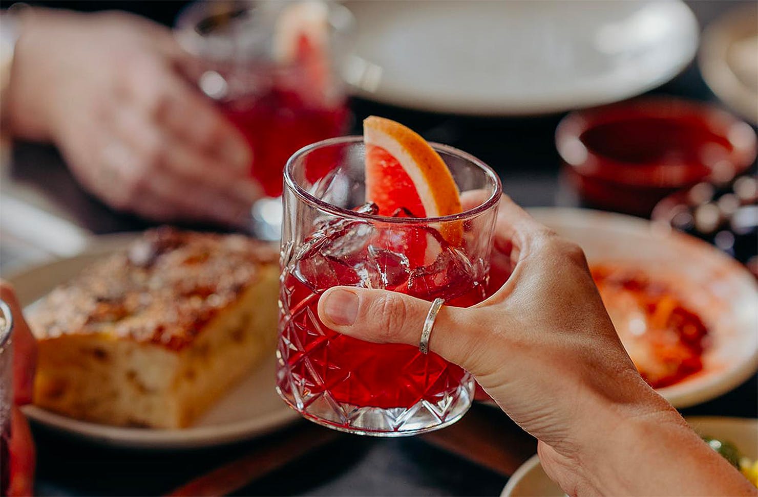 People raise their glasses with Etota, one of the best non-alcoholic drinks in Australia.