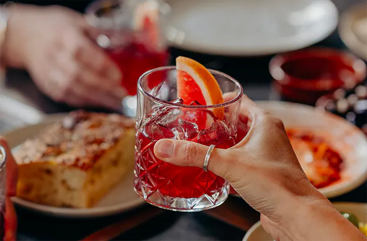 People raise their glasses with Etota, one of the best non-alcoholic drinks in Australia.