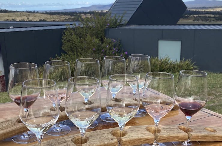 Two wine flights on a table overlooking a Brisbane winery