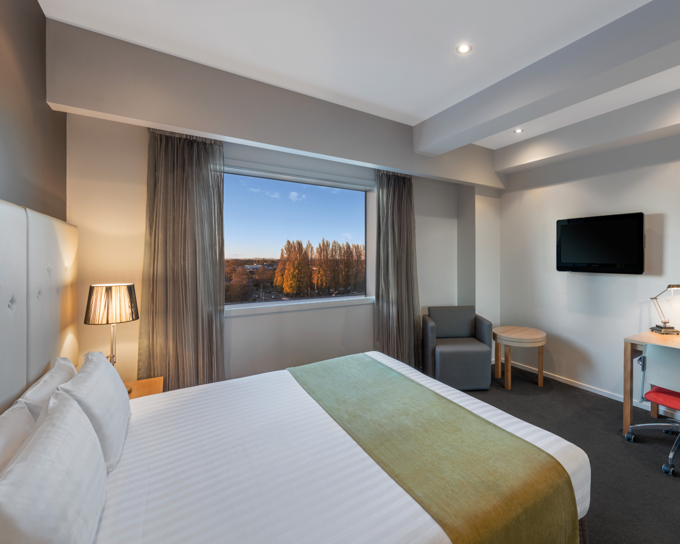 Warm and spacious, a room at Fable Christchurch offers tree-lined city views and a cosy bed