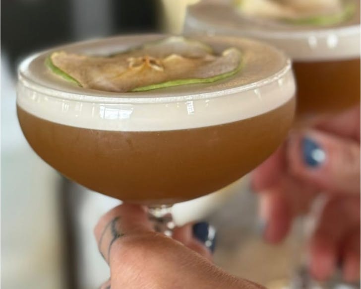 An apple-topped cocktail at Fabric, one of the best bars in Auckland. 
