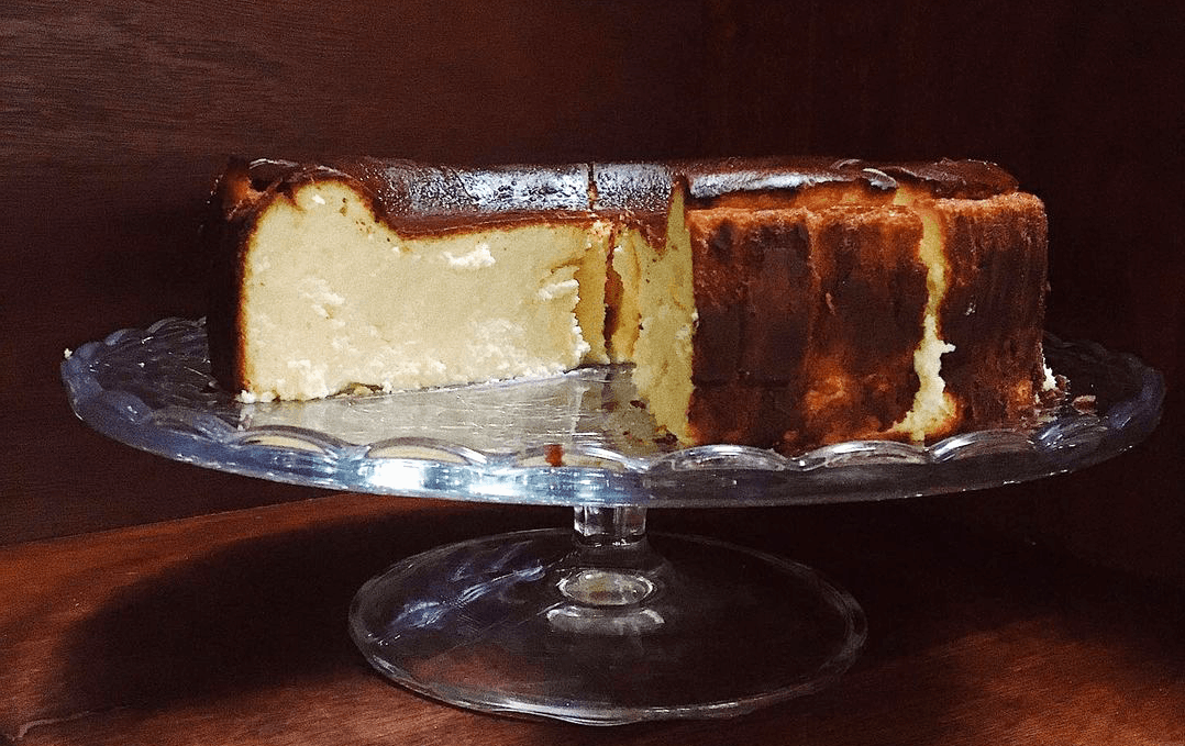 A cheesecake with a slice cut out of it. 