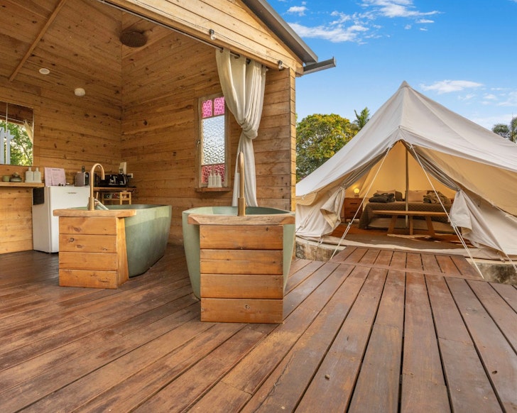 The tent and outdoor bathroom at FarmStay Yurt Retreat one of the best romantic Airbnbs with outdoor baths Sunshine Coast
