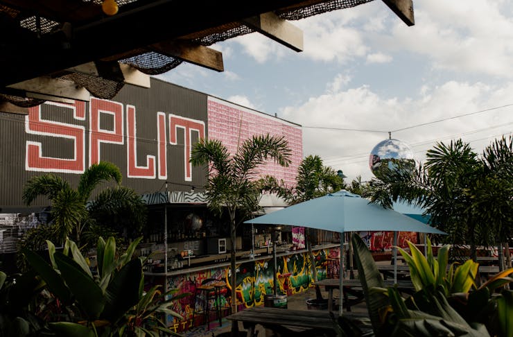 a graffitied rooftop bar