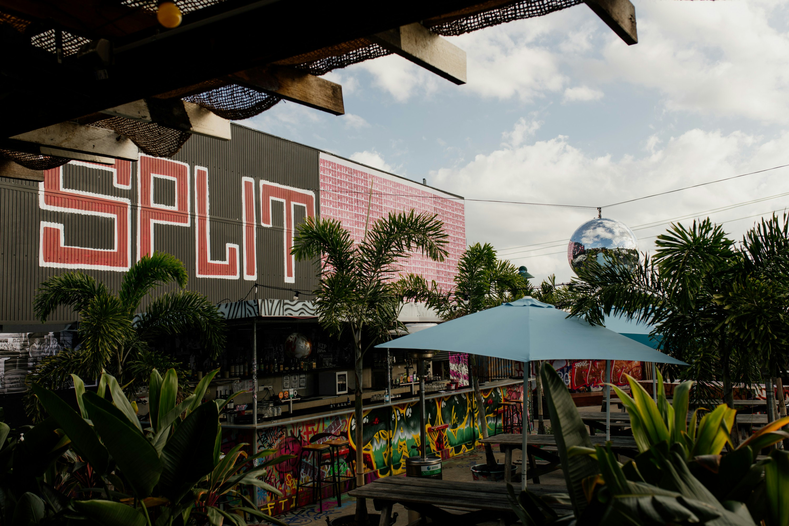 a graffitied rooftop bar