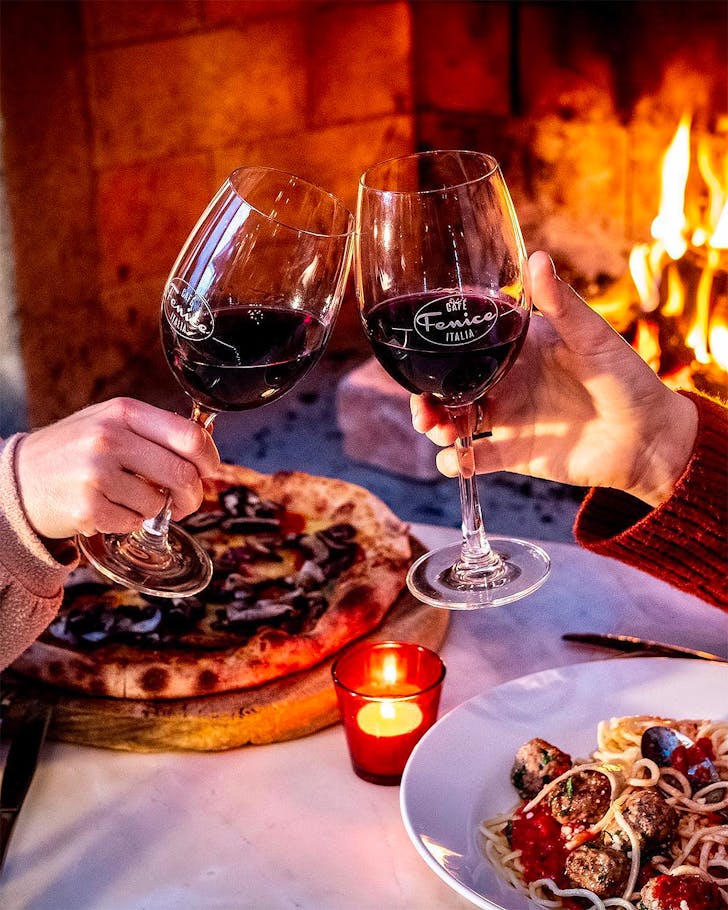 People clink their glasses at Fenice, one of the best restaurants on Waiheke Island.