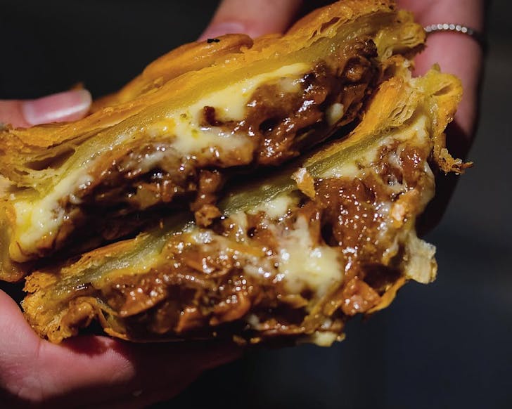 A delicious-looking cross-section of a flaky pie. 