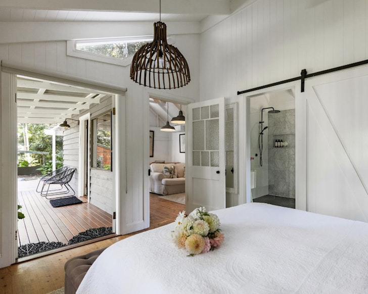 The bedroom at Fig Tree Villa best winter cabins near Brisbane
