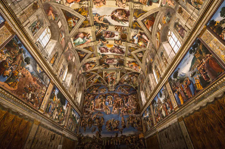 Adorned and ornately painted ceiling and walls at The Sistine Chapel at The Vatican in Rome