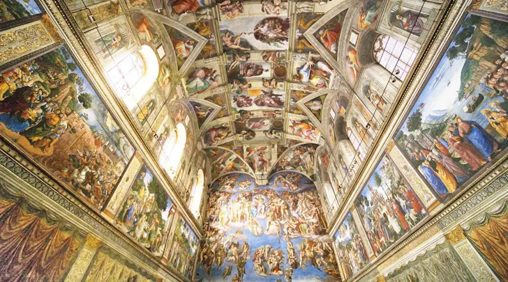 Adorned and ornately painted ceiling and walls at The Sistine Chapel at The Vatican in Rome