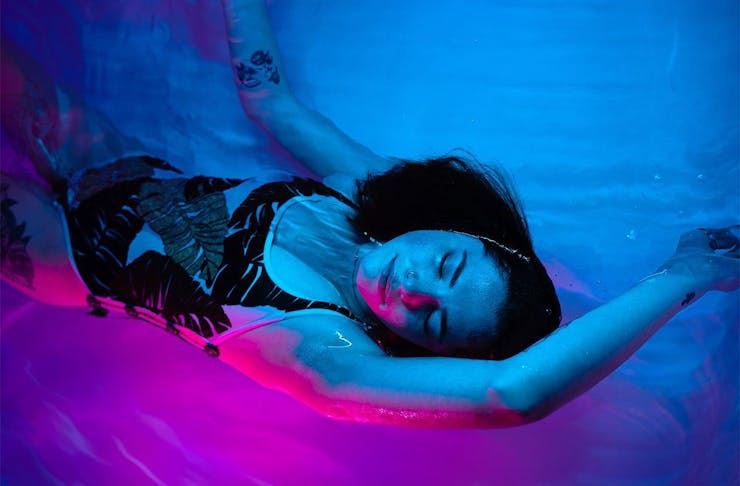 A person floats blissfully in a float tank at Float Culture, one of the best float tanks in Auckland.