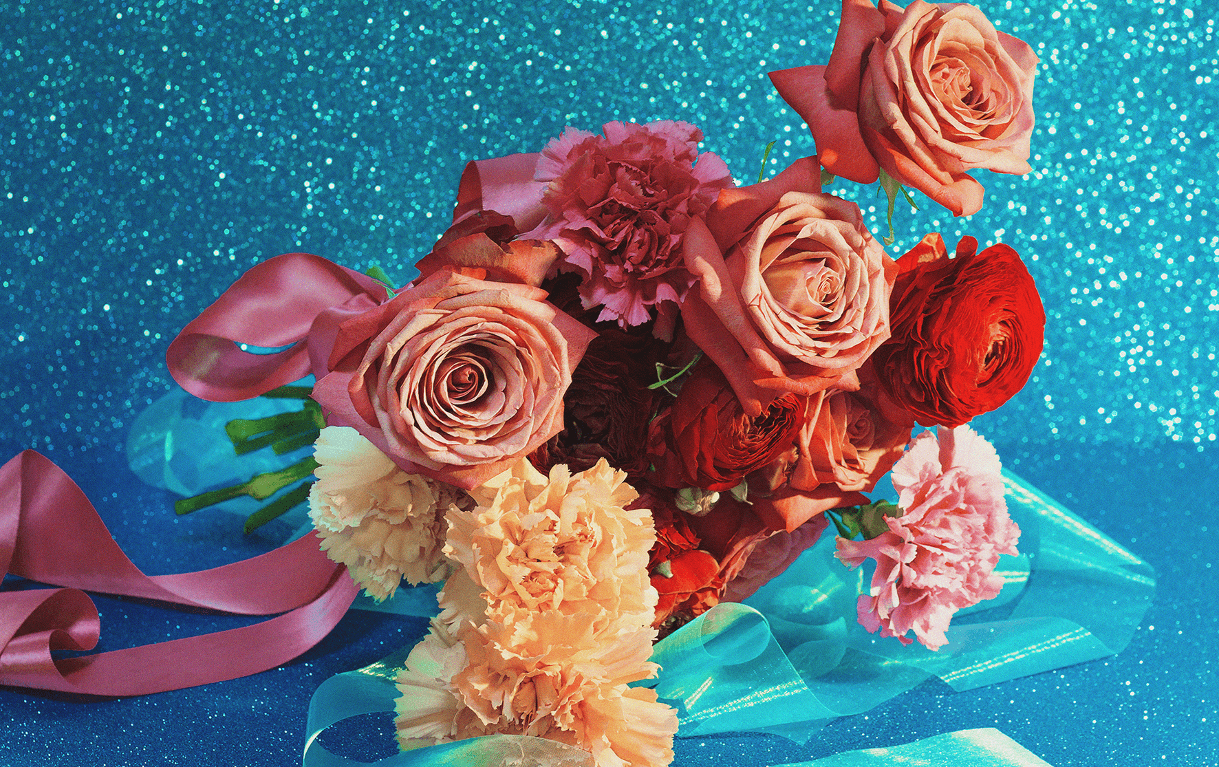 A bouquet with a sparkly blue background.