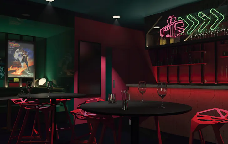 The inside of a lounge of a cinema with a neon light. 