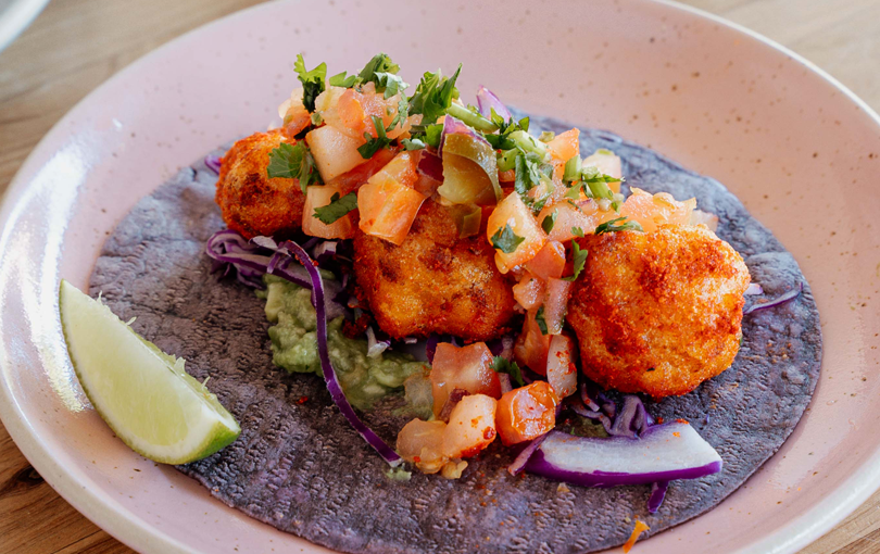 A purple taco with fried fish at one of the best Mexican-style restaurants in Melbourne.