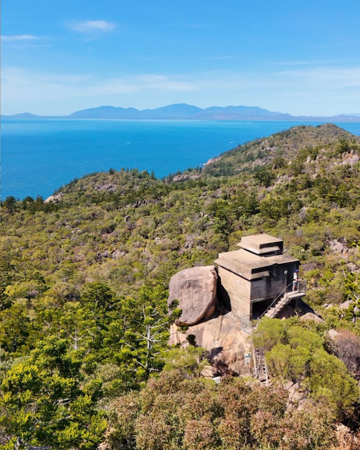 Sweeping view of the Coral Sea over an old military building from Forts Walk on Magnetic Island, Townsville.