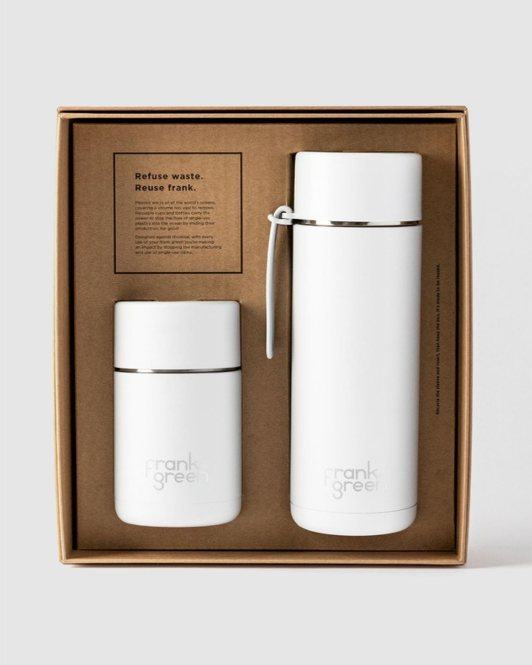 A small white reusable cup and large white reusable bottle packaged in a brown paper box.