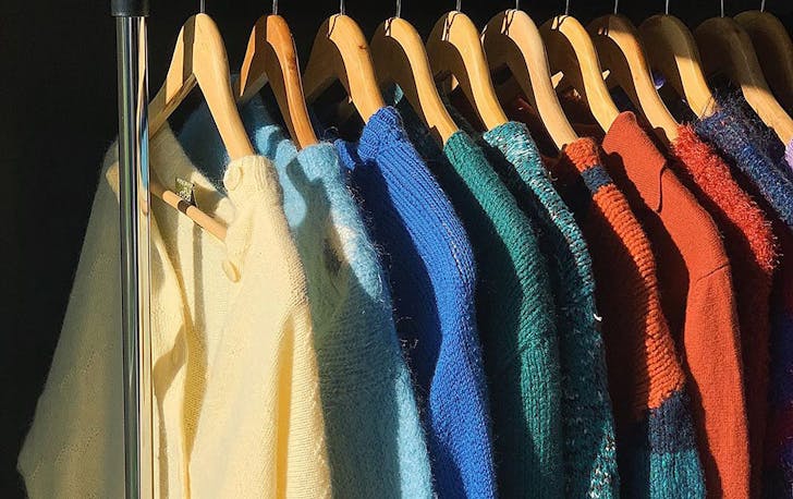 A line of cosy knits on a rail in an image from Fruit Bowl Vintage's Instagram account.
